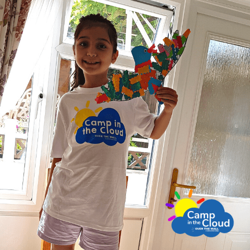 Young girl holding craft in Camp in the Cloud t-shirt