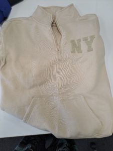 Cream Jumper with "NY" on front