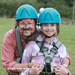 Camper with feeding tube and Parent at Over The Wall Family Camp 2023