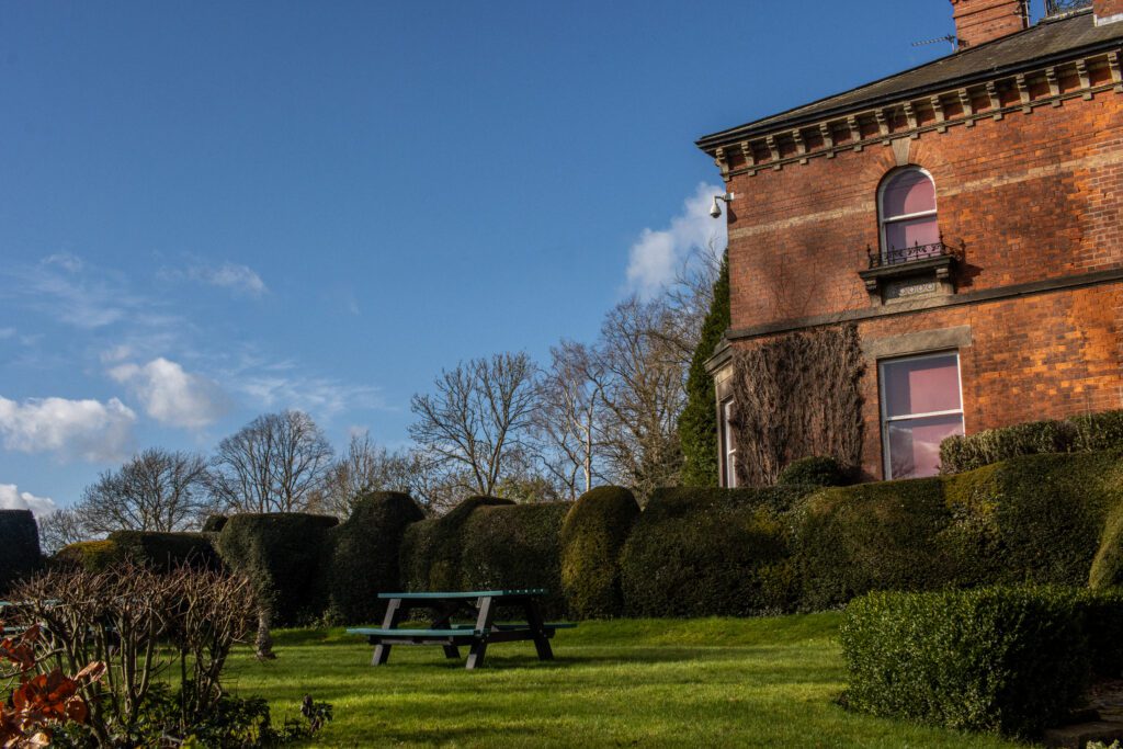 Blue sky with a red brick building