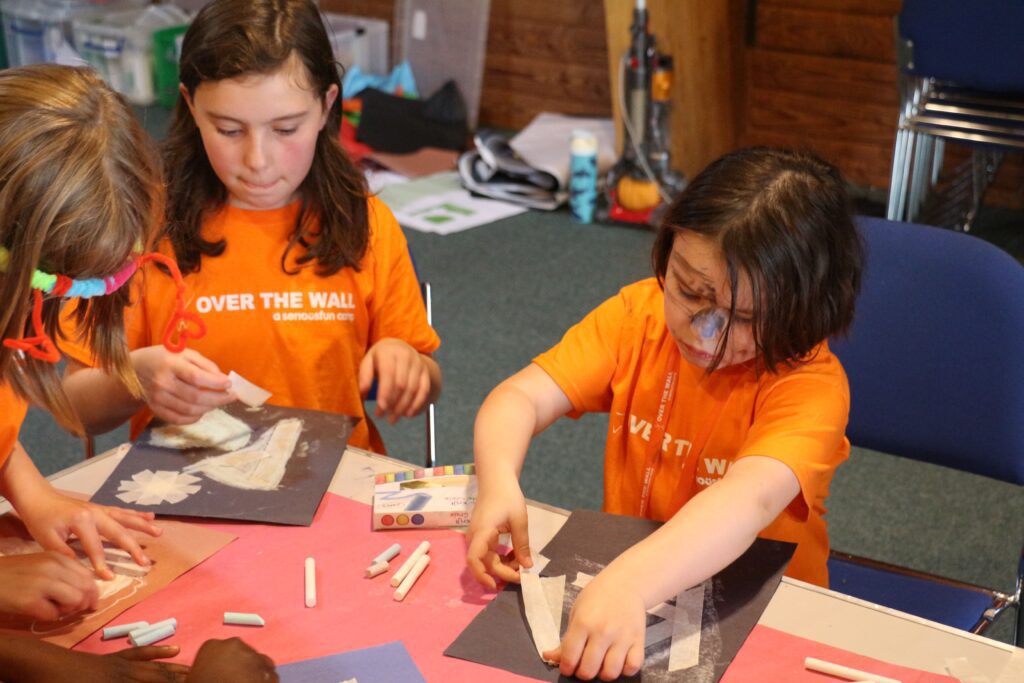 Two campers doing arts and crafts