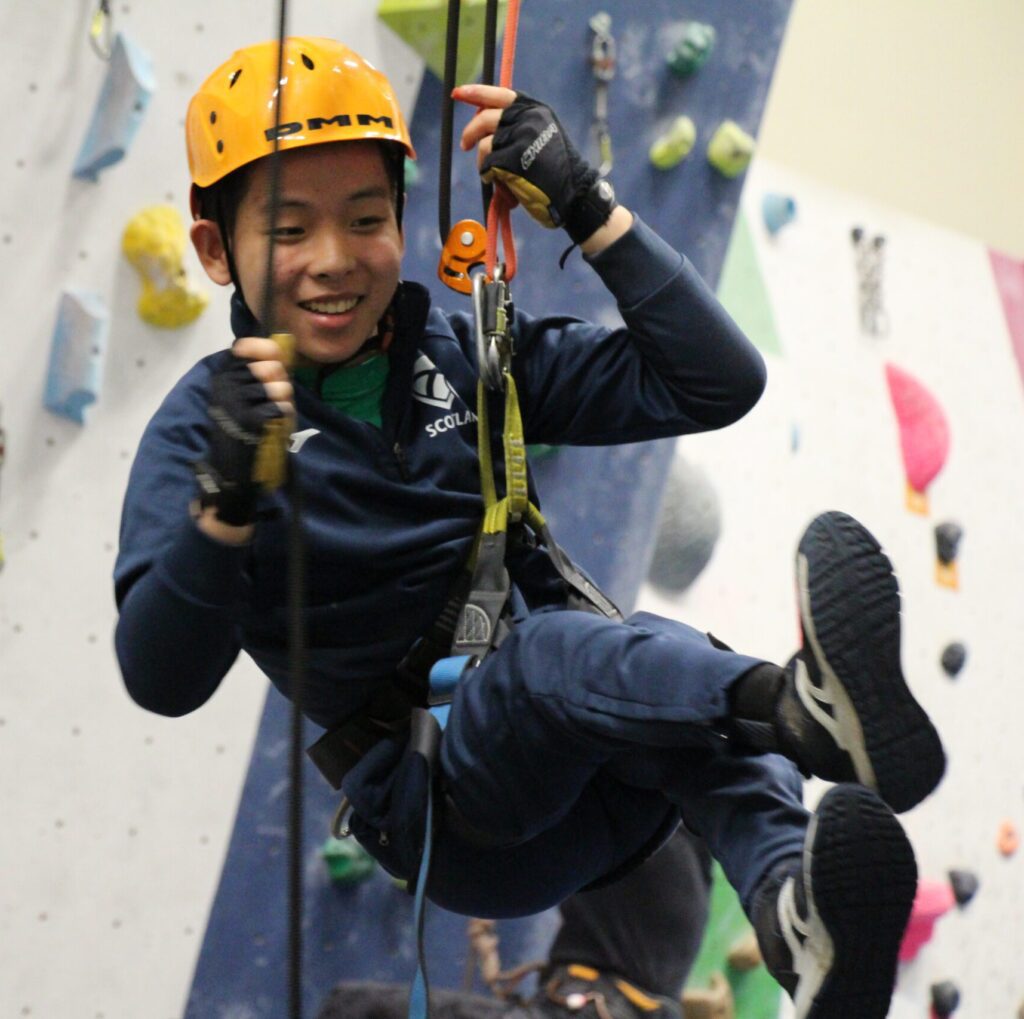 Young camper abseiling at an Over The Wall Camp