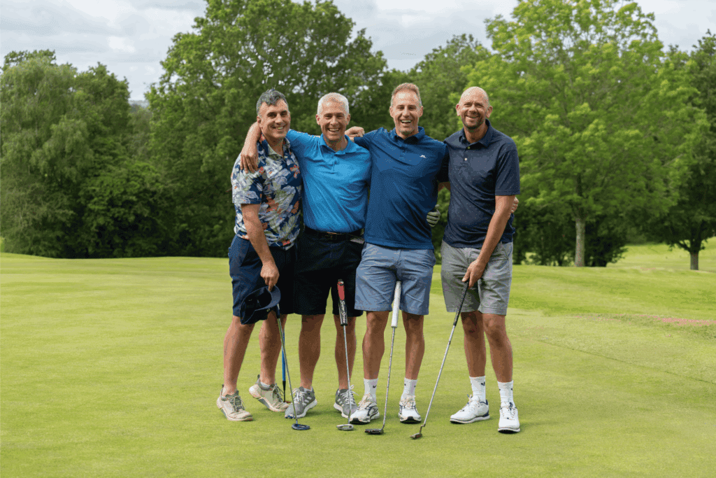Four male golfers